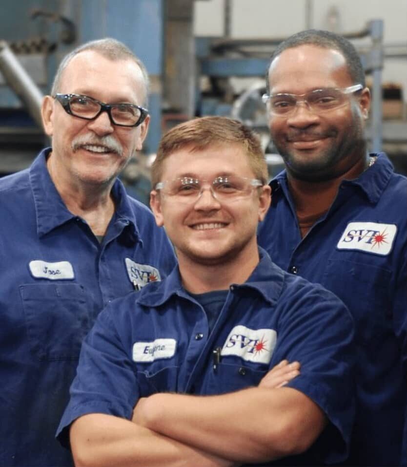 Smiling group of SVI employees